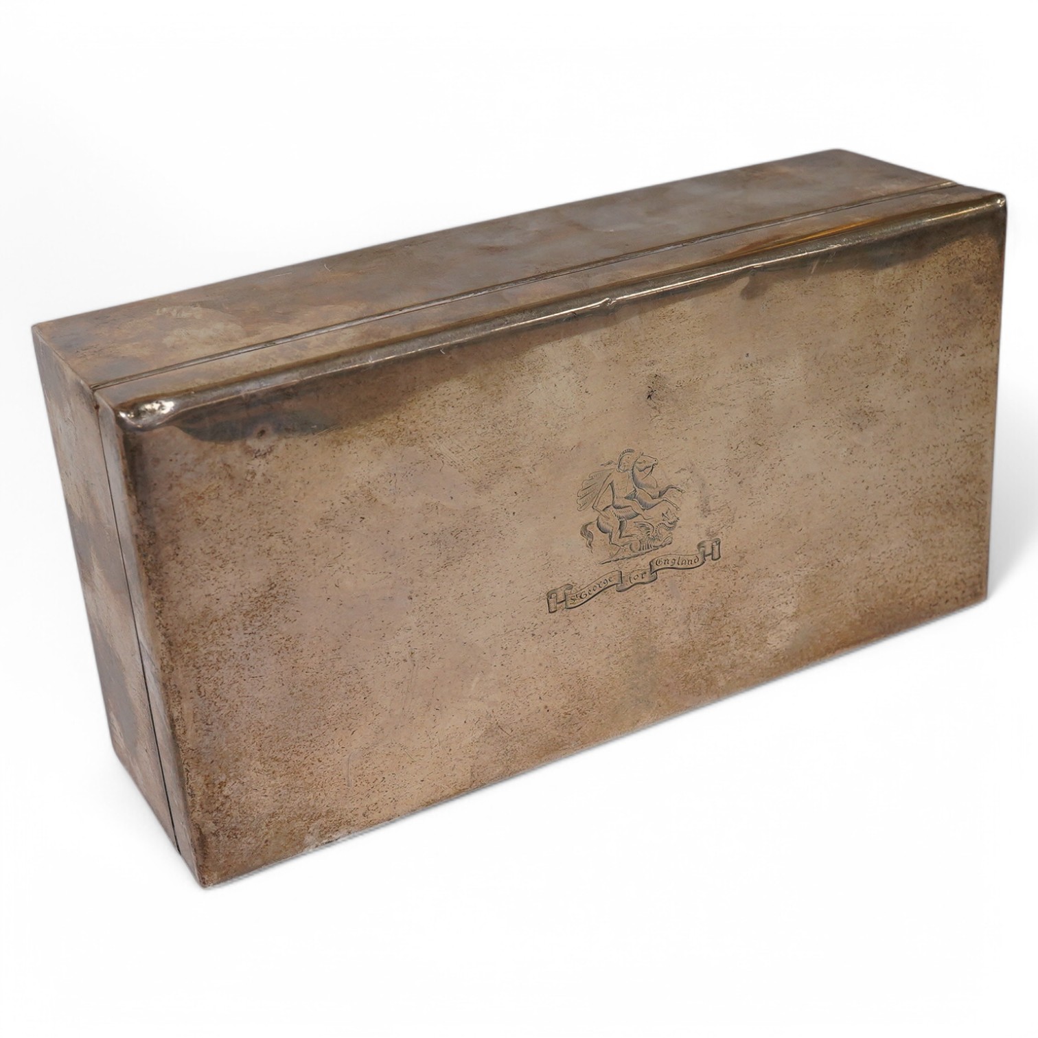 An Elizabeth II silver mounted rectangular cigarette box, by Garrard & Co, Birmingham, 1957, with engraved crest and motto, 18cm. Condition - poor to fair